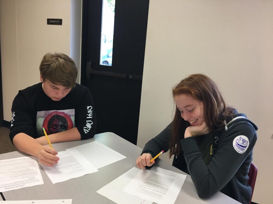 Jaden Simmons and Jesse Carlson work diligently on their works for the competition
