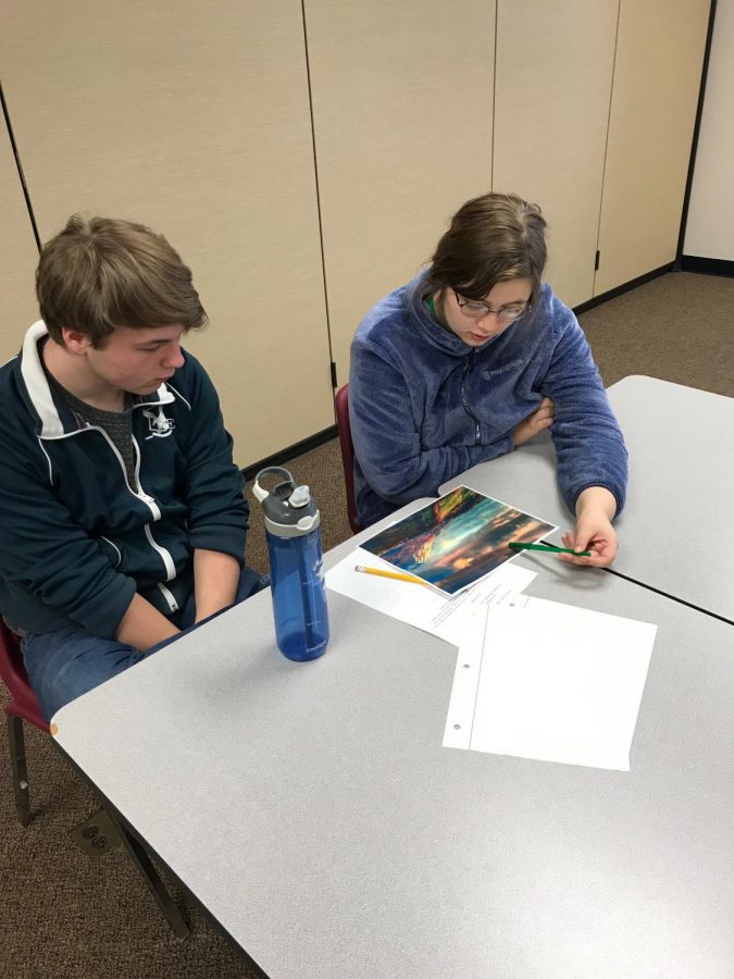 Members of the Language Arts Club work on their submissions.