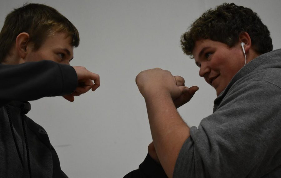 Two SLHS students prepare to practice boxing, inspired by Creed II.
