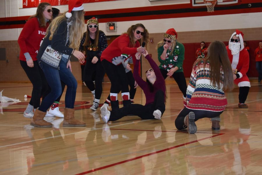 Mrs. Long lays down some fresh rhymes at the assembly.