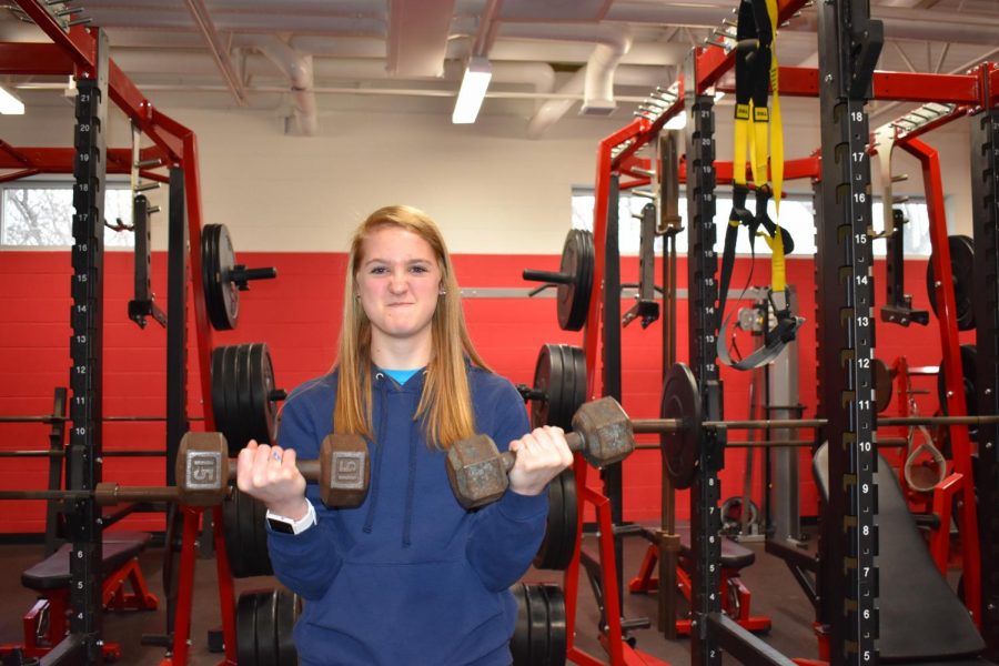 Chloe OBoyle pumps iron in preparation for track.