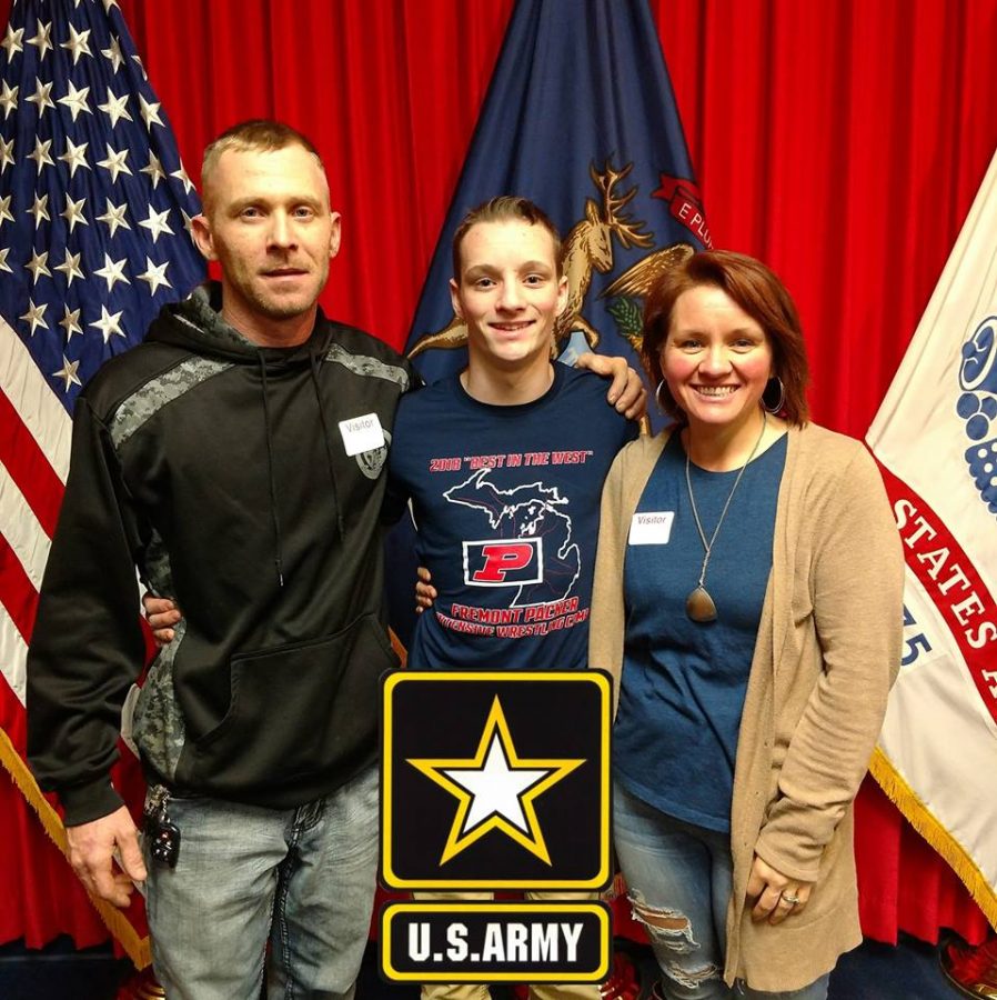 Alex Newton poses with parents Josh and Juanita Smith after officially becoming part of Michigans Army National Guard.
