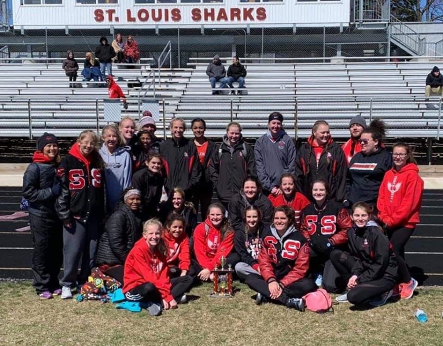 The+girls+team+celebrates+after+tying+with+Alma+for+first+place+at+the+St.+Louis+Relays.