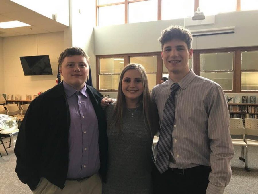 Three NHS students pose for a photo.