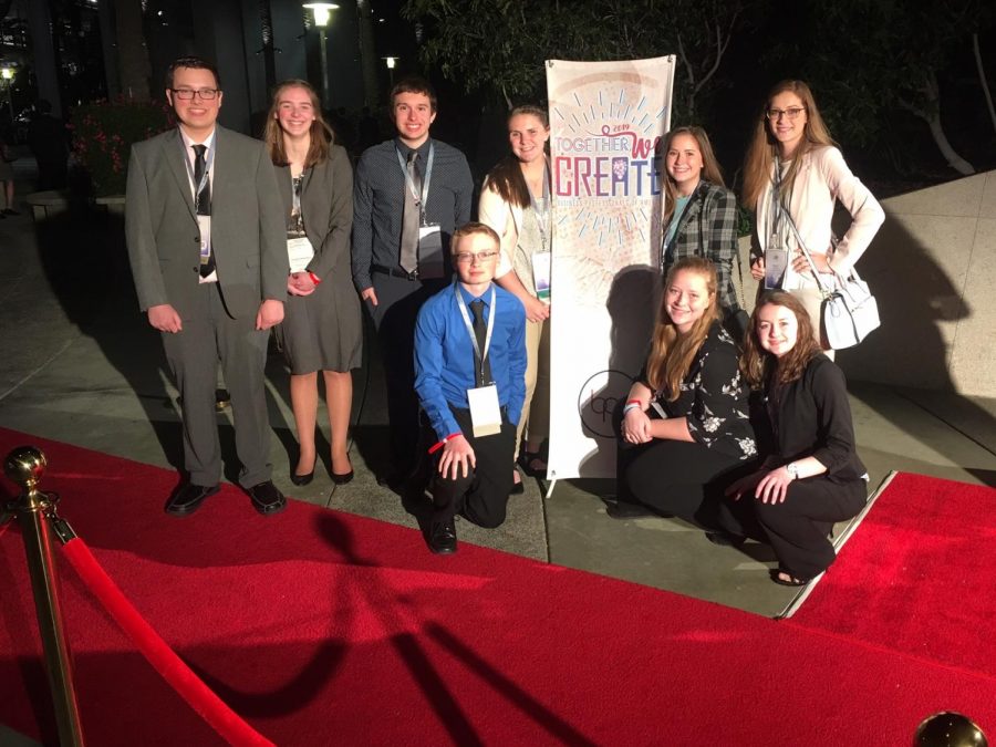 Saint Louis BPA poses for a photo on a fancy red carpet.