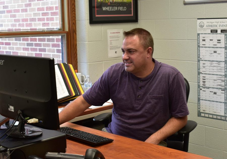 Mr. Hemker works in his office.