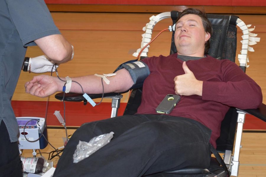 Eric Huff gives blood.