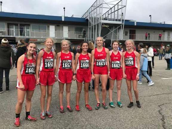 The girls team celebrates a ninth-place finish.