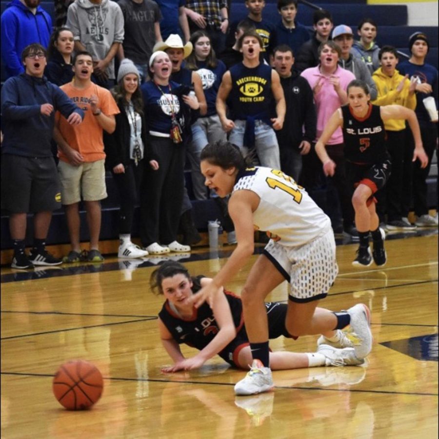 Joslynn Clark dives for a loose ball.