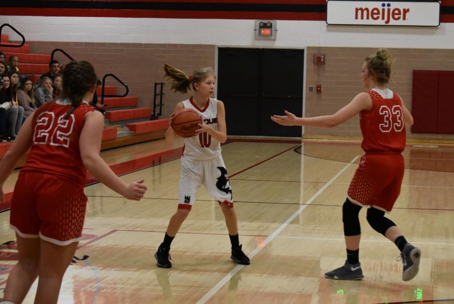 Mikaila Borie handles the ball while surveying the floor for open teammates