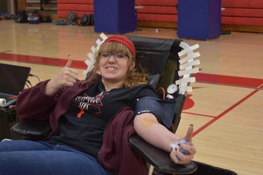 Kira Dowell donates blood at the blood drive.