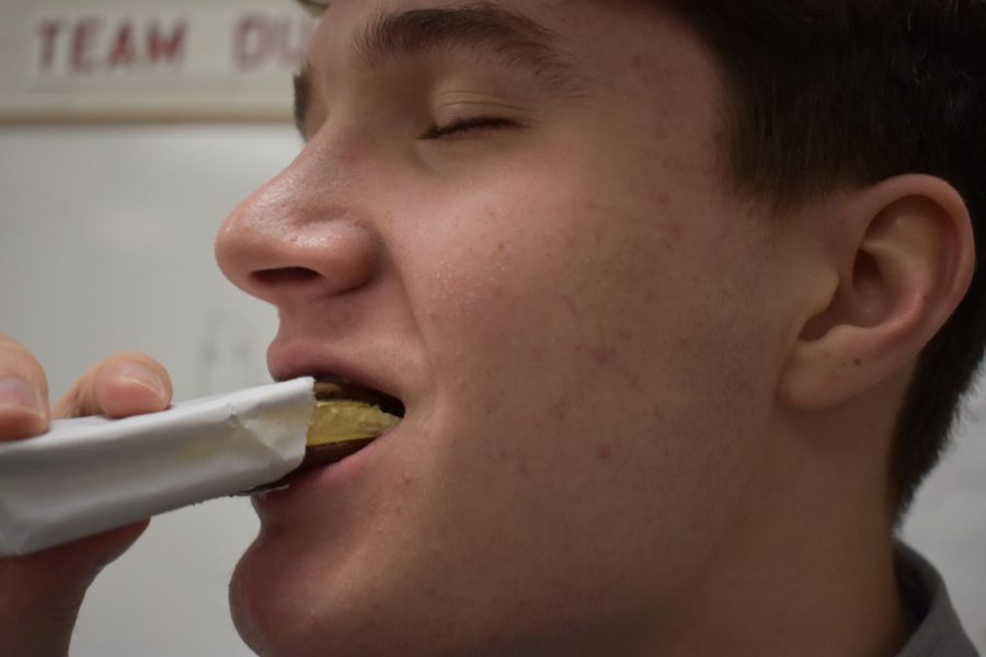 Ethan Wilson enjoys an ice cream sandwich as a reward for his hard work in the classroom.