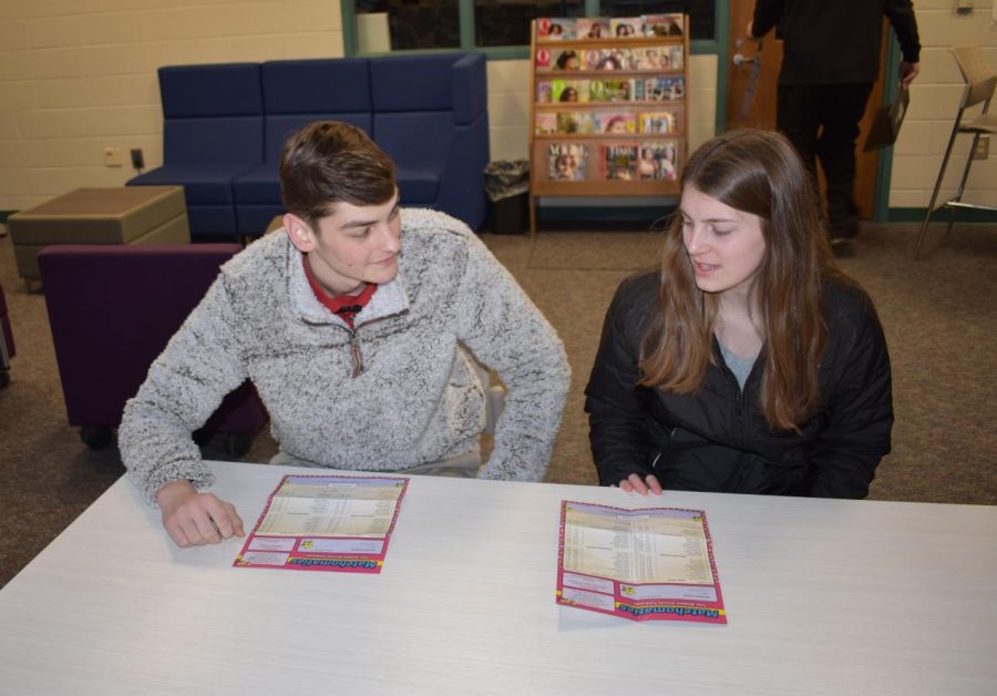 Corban Allen and Gina Shebester compare their results.