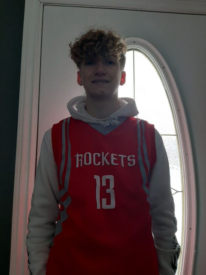 Hunter Burr wears a James Harden jersey from when he was still on the Houston Rockets.