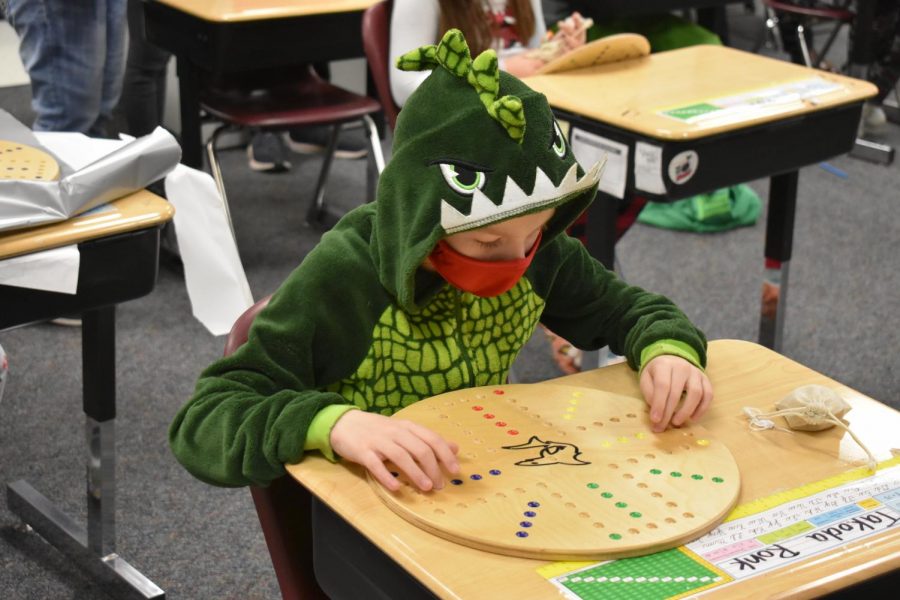 The fifth-grade students received a hand-made board game to enjoy with their families during the holidays.