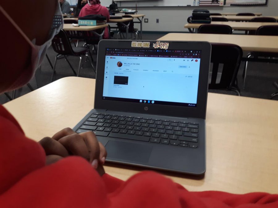 A student checks out Will Tuzas YouTube channel.