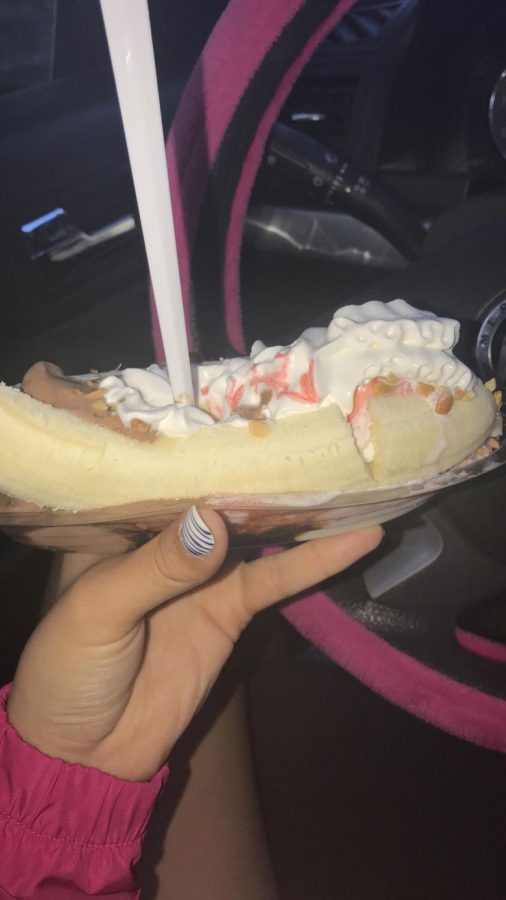 A student enjoys a banana split from Frosty Cone.