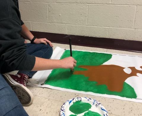 SLHS student paints a picture. 