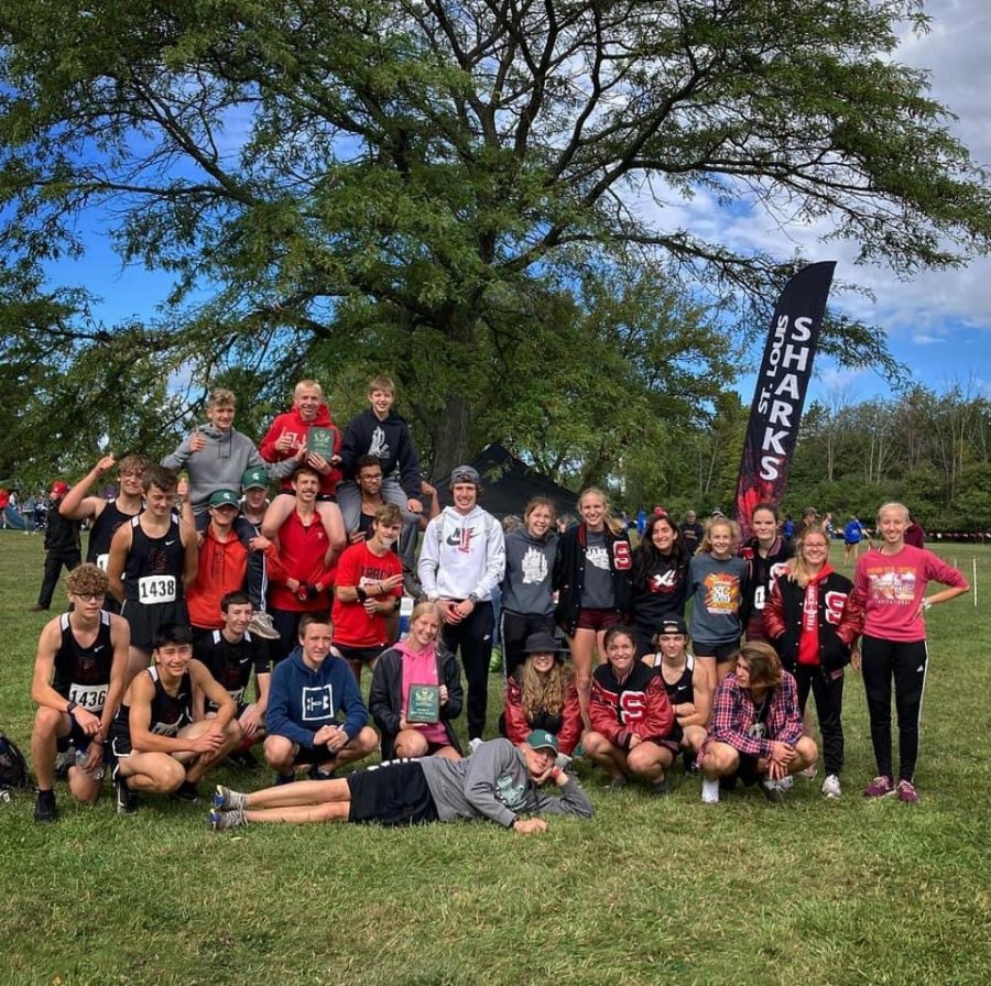 Boys and Girls cross team pose for well earned victory photo!