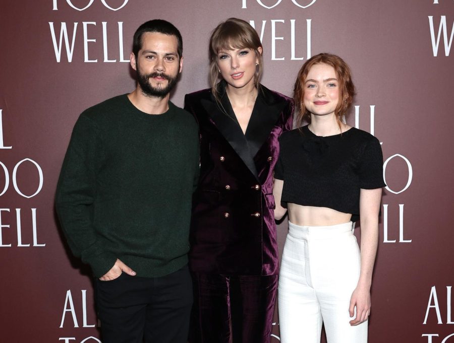 (left to right) Dylan O’ Brien, Taylor Swift, and Sadie Sink pose for a group photo at the premier of Swifts All Too Well short film.