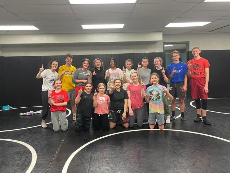 The Girl's wrestling team poses together after their first practice at SLHS in the wrestling room.