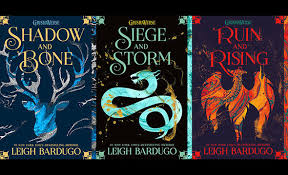 This picture displays the three books; Shadow and Bone, Ruin and Rising, and Siege and Storm that are part of the Grisha series. 