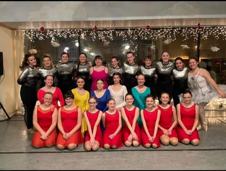 SLHS+students+Elizabeth+Starry%2C+Leah+Chvojka%2C+and+Tori+Patterson+perform+for+Academy+of+Performing+Arts+Company+in+downtown+Alma.%0A