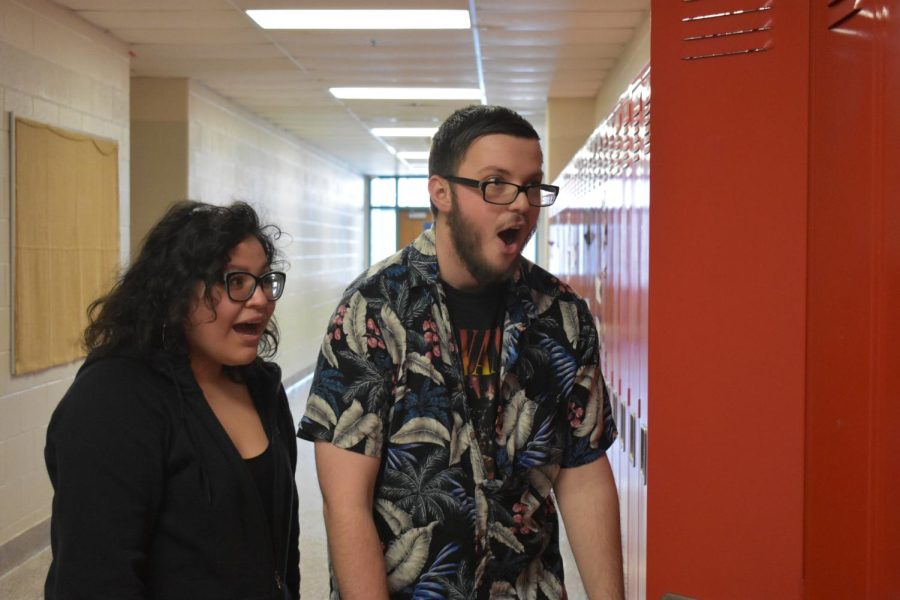 Grant Bebow and Evelynn Gutierrez stand still in shock as they hear the latest tea of SLHS from the bright, not so jolly, red locker. 