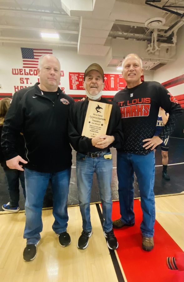 Former assistant Varsity coach Shane Shaw (Left) Former varsity coach, Bob Threloff (Center) and 35 year Middle School wrestling coach Pat McLaughlin (Right) accept the plaque at the invitational.