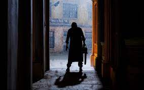 Leatherface lurks in the shadows, waiting for his prey to make their move.