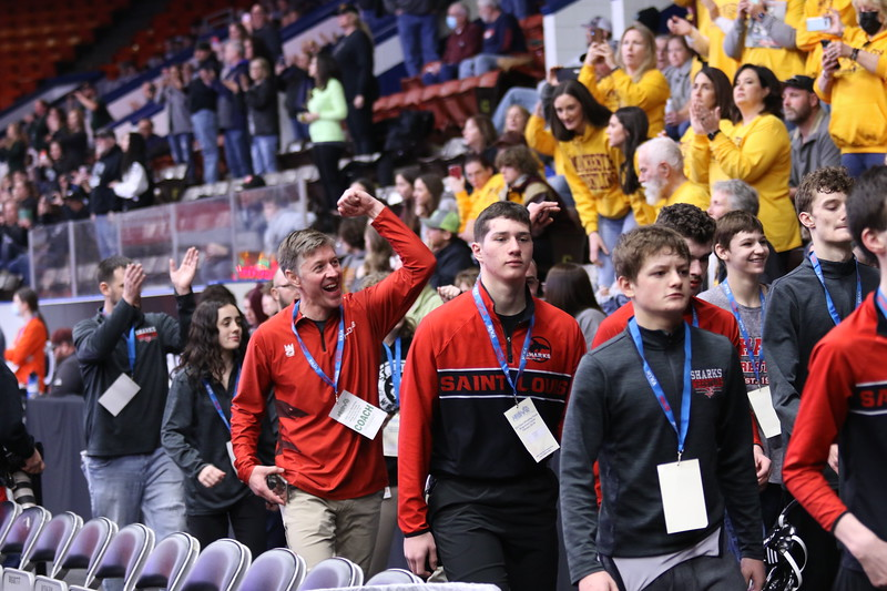 Coach Kevin Kuhn celebrates making it to semifinals at team state competition in Kalamazoo’s Wings Event Center.