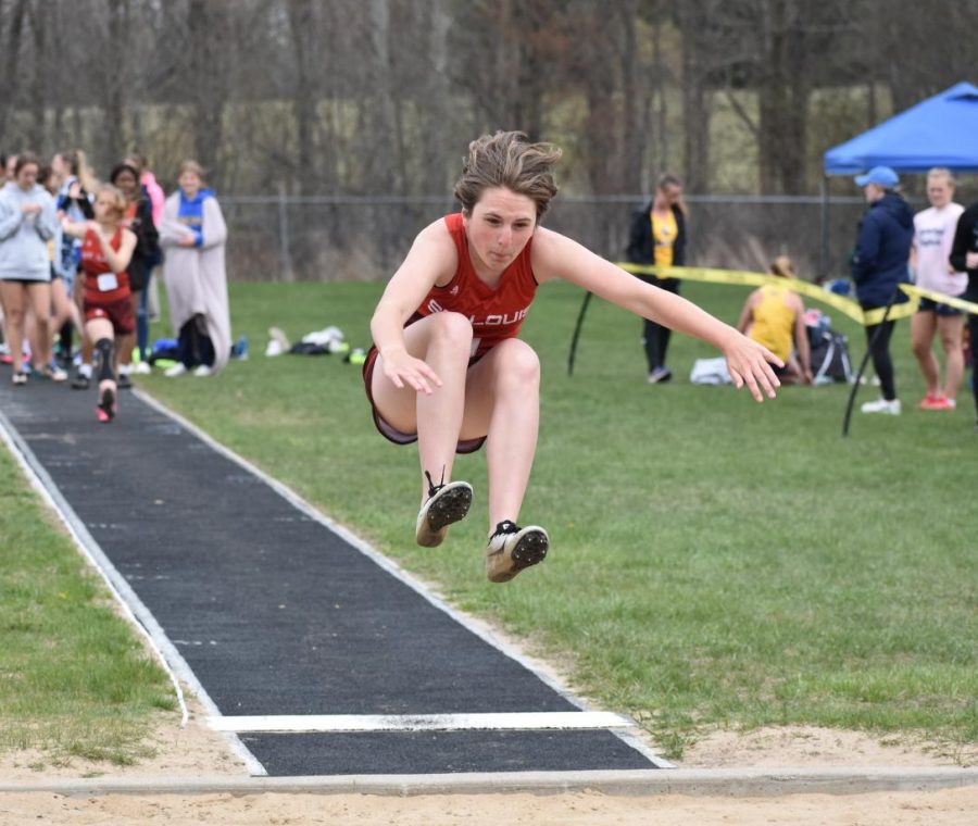 Lilly Massaway takes a huge leap at long jump. 