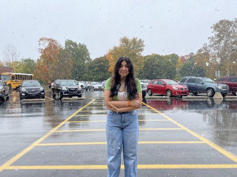 Student Maria Puga-Trevino freezes in the snow as she came to school unprepared for the weather.