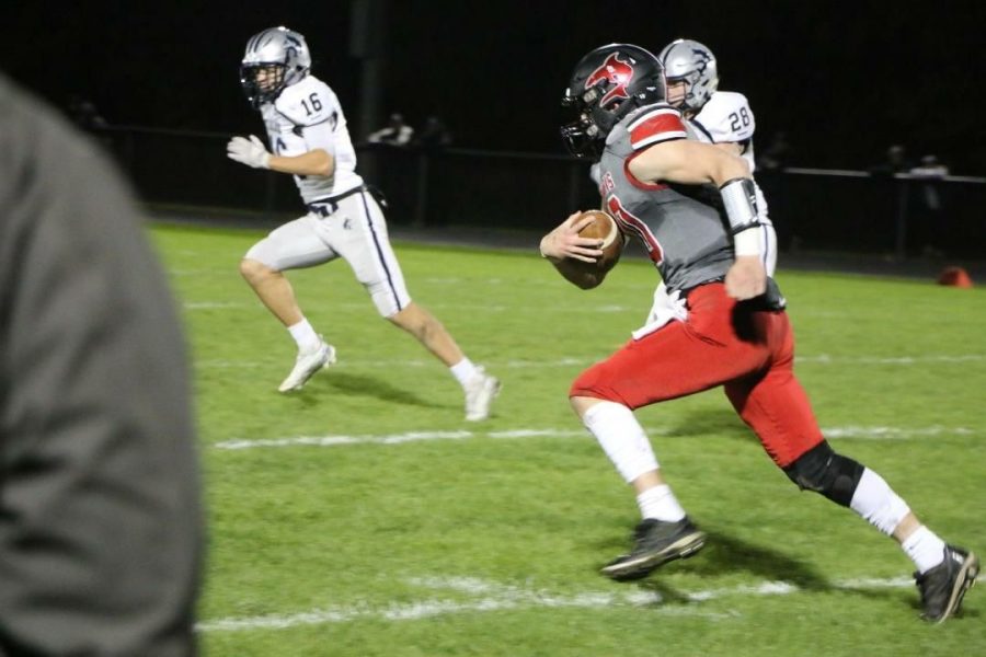 This picture captures Thomas Zacharko carrying the ball down the field. 
