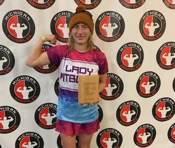 Mullins poses with a award after one of her big wresting matches. 