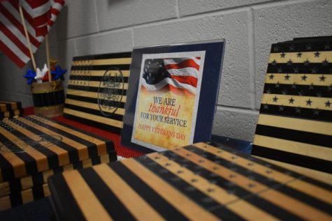 This photograph displays the plaques and sign that was welcoming the veterans. 