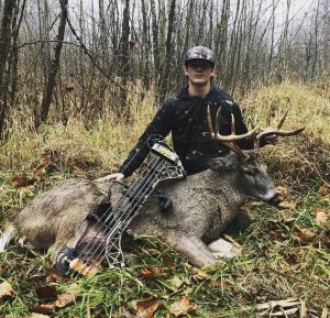 Ashton Leonard poses with his buck which he got while hunting in Ohio. 