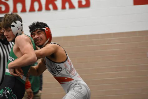 Genaro Soto pushes his opponent to the side of the mat. 