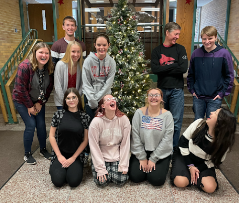SharkScene Staff laugh together as they pose for a Christmas photo.