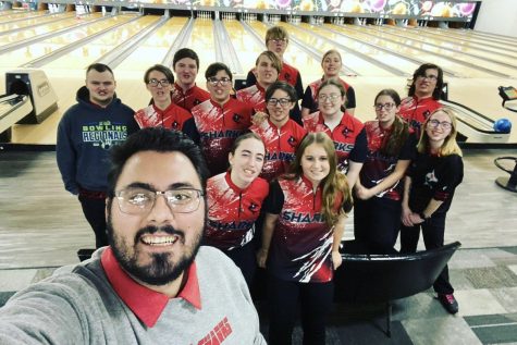 Girls and Boys bowling teams pose together for a selfie taken by Coach Bernia. 