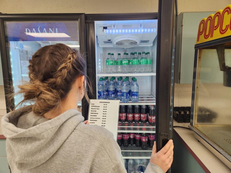 Student Natalee Hoyt attempts to navigate through the hard choice of which drink to buy with the new concession prices. 