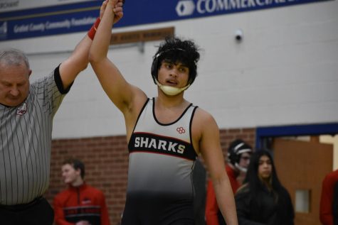 Wrestler Jonathan Flores Nunez brings it all onto the mat.