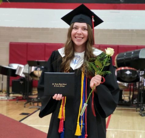 Senior class president Peyton Kuhn smiles for the camera as she graduates
