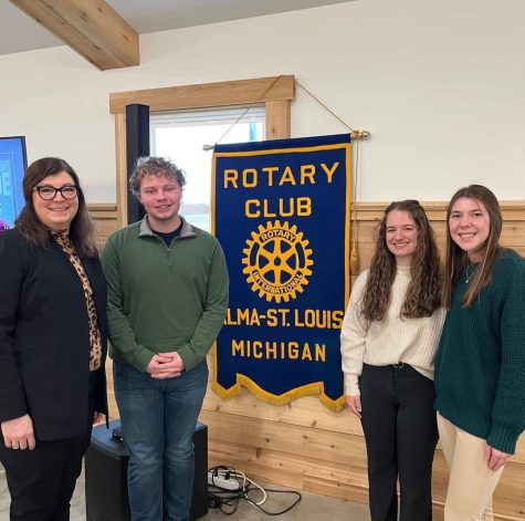 Rotary club founder Curtis Brashaw stands with Ms. B.G. and seniors Laney Pestrue and Payton Kuhn