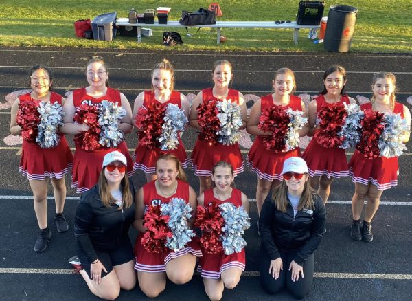 The poms squad celebrates a routine well performed!