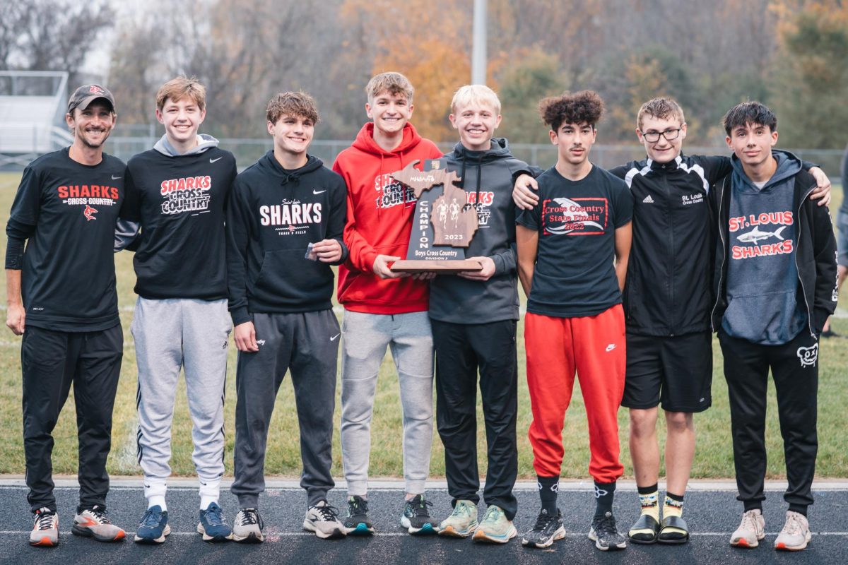 The boys cross country team comes together after bringing home the bacon at regionals.
