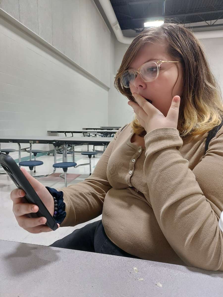 Sophomore Leia Firman stares at her phone in a state of shock as the alarm goes off!