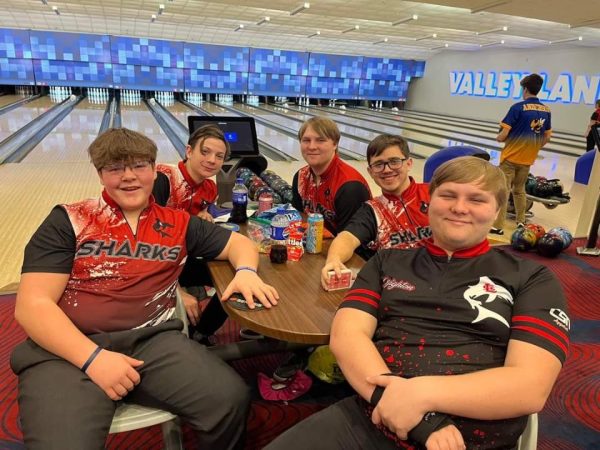 The varsity boys bowlers stop during their busy day to take a break and pose for the camera!