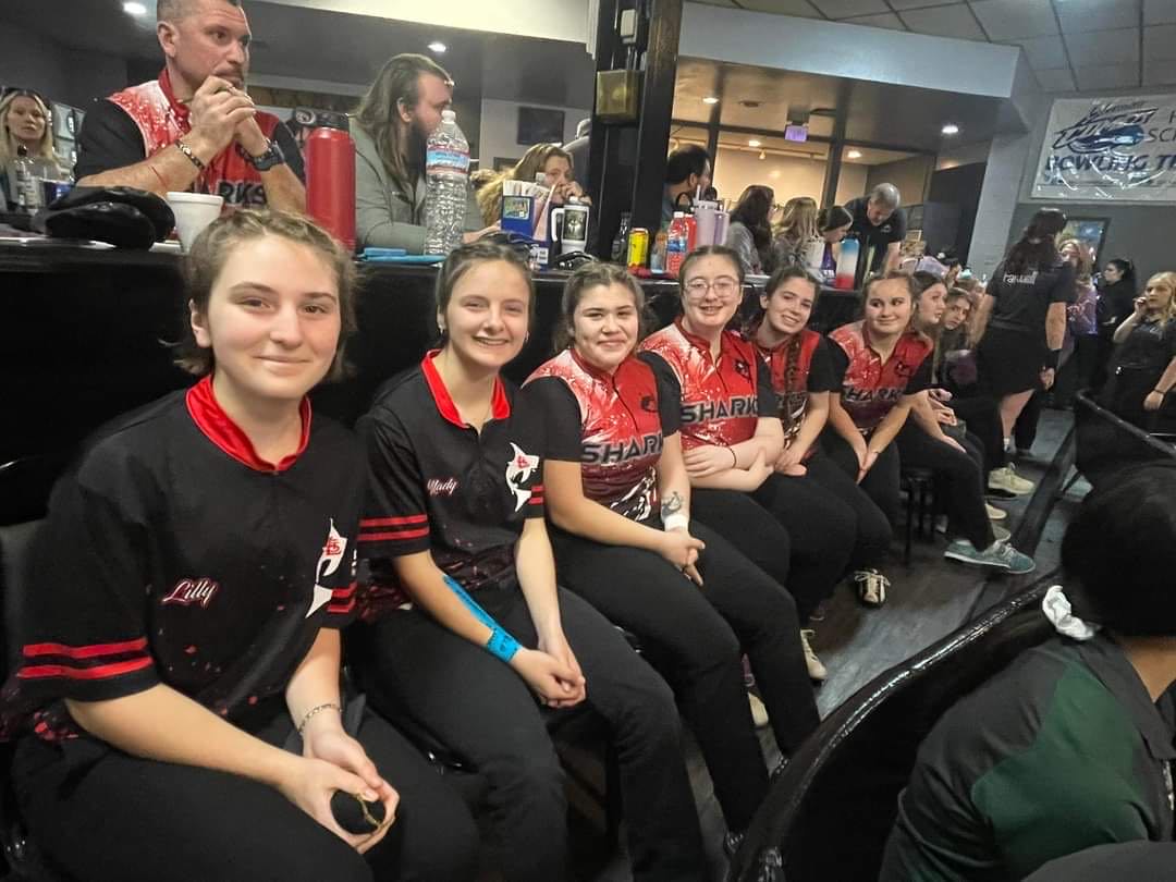 The varsity girl bowlers smile at their regional tournament!