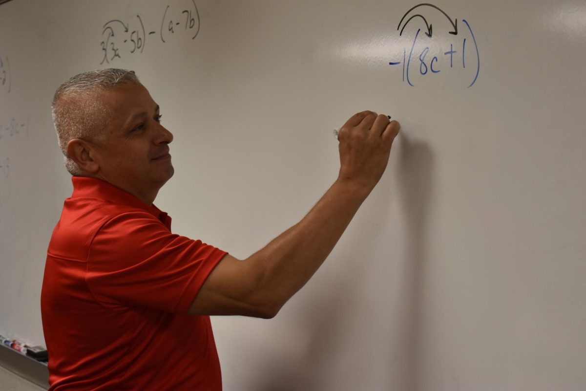 Mr. Passalacqua teaches his eager math students.